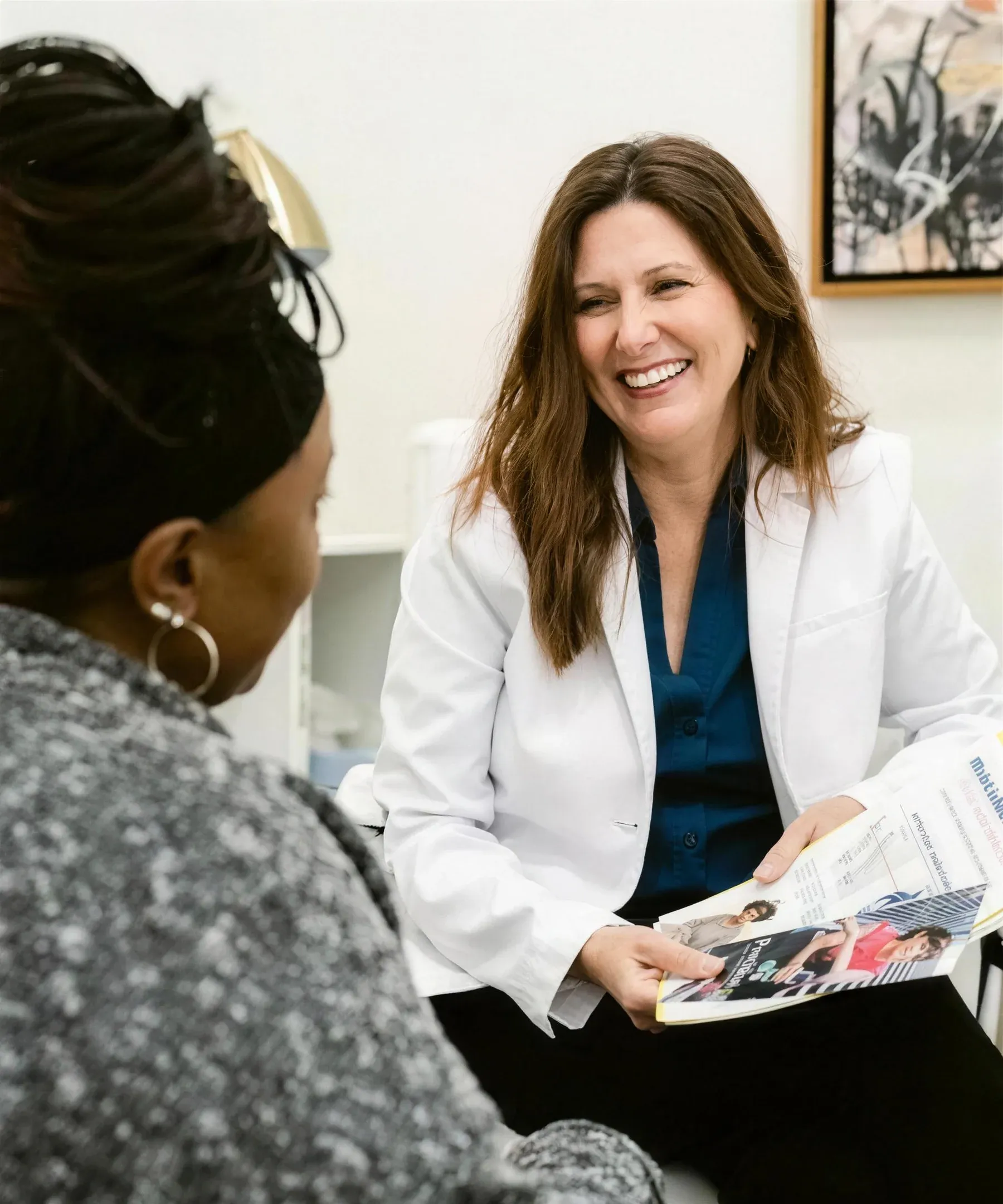 Dr. Traci McCormick talking with a patient during a consultation